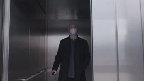 Masked Man with a Beanie Inside an Elevator Stockbeeldmateriaal 208776611