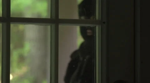 Masked man breaking in Stock Footage 44103204