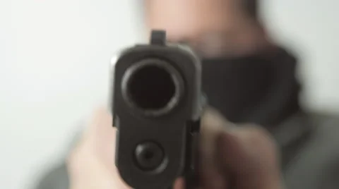 Masked Man Close Up Quickly Draws a Gun Stock Footage 61271780