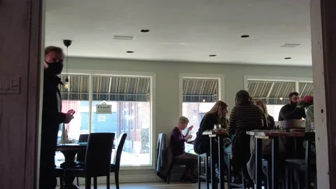 Masked Man Customer Comes Into Restaurant Waiting To Be Seated Stock Footage 221875331
