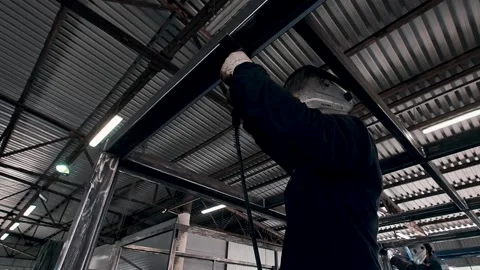 The masked man is engaged in welding. Video stock 130348468