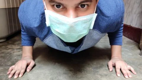 Masked man Exercise  Stock Photos