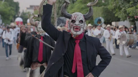 Masked Man Gesturing During Parade in Oaxaca, Mexico, Slow Motion Stockbeeldmateriaal 342366607