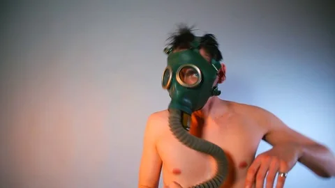 A masked man makes dance moves at a nightclub party. Video stock 124543298