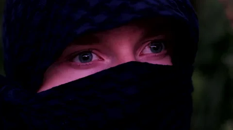 Masked man opens his eyes Stock Footage 41578477