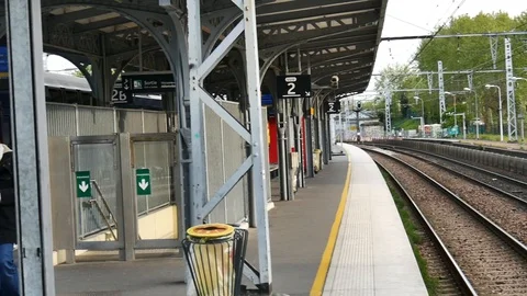 Masked man on paris suburb train dock- COVID19 Stock-Footage 128605225