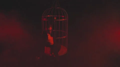 Masked man in red light in smoke dancing Stock Footage 149705487