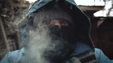 Masked man with smoke Stock Footage 154427850