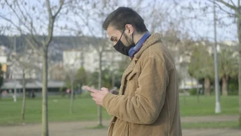 Masked Man Texing Phone Stock Footage 147357442