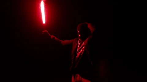 Masked Man With Torch, Reveals Himself Stock Footage 67670738
