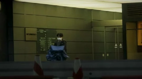 Masked Man Walking Inside Modern Tokyo Building Lobby Area Stock Footage 335102934