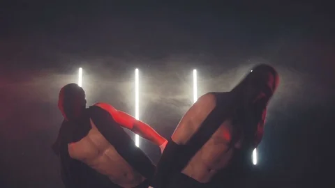 Masked men dancing in smoke Stock Footage 105545487