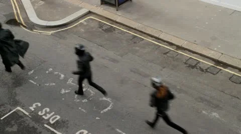 Masked men run down street Stock Footage 17783858