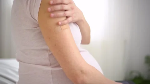 Masked mom-to-be post vaccination Stock-Footage 308017291