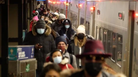 Masked passengers arrive in New York City during COVID Stock Footage 148244584