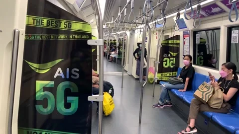 Masked passengers ride subway using smartphones - POV shot while standing Stock Footage 171147800