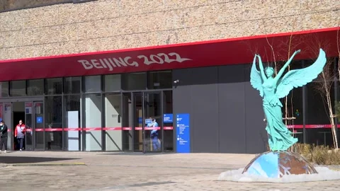 Masked people, working credentials, man carrying box, walking by the Stock Footage 219767799