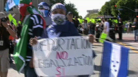 Masked protesters - Immigration march and rally Stock Footage