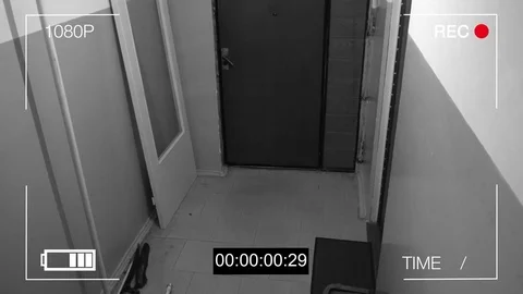 The masked robber burst through the door and broke the security camera with a Stock Footage 75313694
