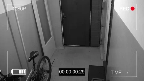 The masked robber burst through the door and threatened with a knife in CCTV Stock Footage 75313759