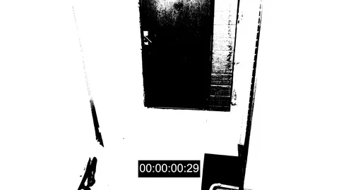 The masked robber burst through the door and broke the security camera with a Stock Footage 83721970