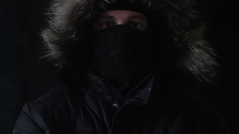 The masked robber shows to the camera the finger Stock Footage 73706033