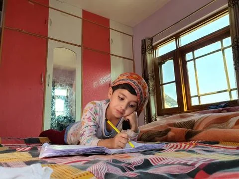 Masked School students are doing home work in home in covid-19 Stock Photos