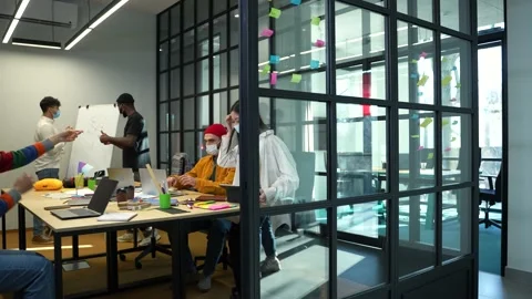 Masked startup team during work in modern office Stock Footage 152345183