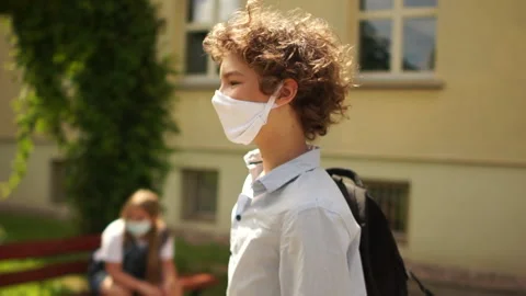 Masked students comply with safety rules during quarantine of coronavirus covid Stock Footage 135540638