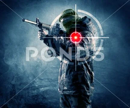 Masked terrorist man with gun and laser target on his body Stock Photos