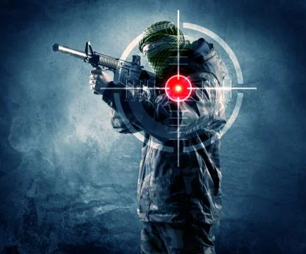 Masked terrorist man with gun and laser target on his body Stock Photos