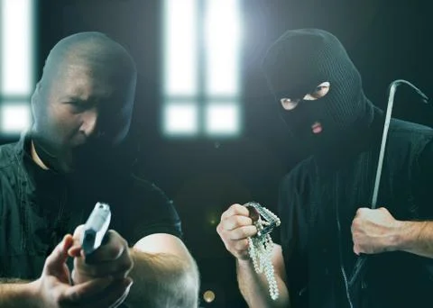 Masked thieves Stock Photos