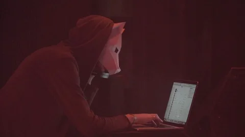  masked wolf man working with laptop in night club helping dj Stock Footage 126358633