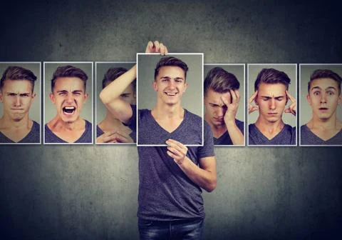 Masked young man expressing different emotions Foto stock