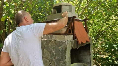 Mason Applying Adhesive Mortar On Brick Chimney Outdoor BBQ Stock Footage 343320106