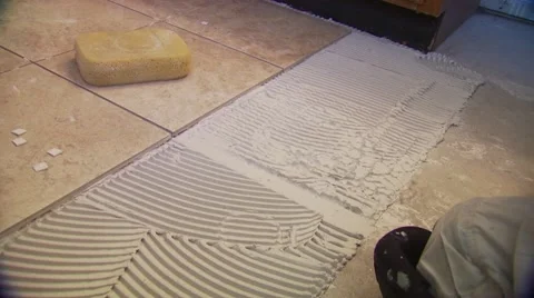 Mason attaching tiles on floor Stock Footage 55570519