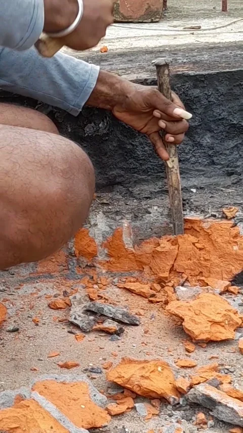 Mason breaking brick with hammer chisel Stock Footage 202175889