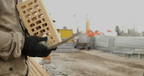 Mason Checks Brick, Builder Lays Brickwork, Worker Creates Brick Wall, Masonry Stock Footage 129500430