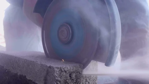 Mason Grinder Cutting a Brick Stock Footage 128098380