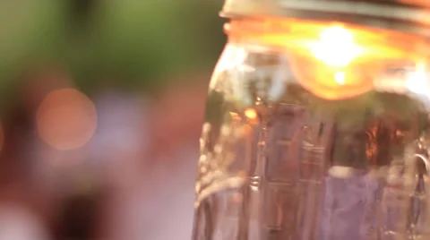 Mason Jar and Dancing in the Background  W/ Jump Cut Stock Footage 52141288