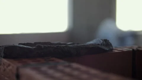 Mason spreading mortar on bricks with trowel Stock Footage 318383161