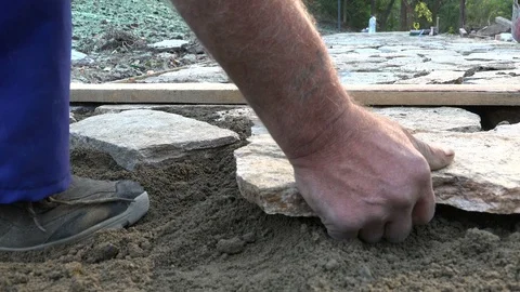 Mason workers making sidewalk pavement with stone blocks Stock Footage 97216644