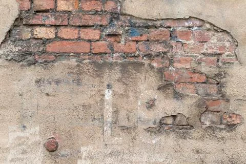 Masonry with broken stucco as a background. Stock Photos