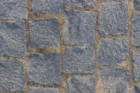 Masonry in gray granite, background, texture Stock Photos