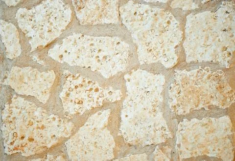 Masonry light rubble stone. Stock Photos