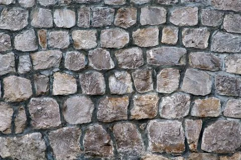 Masonry Rock Wall Texture. Texture of a stone wall. Gray stone siding with di Stock-Fotos