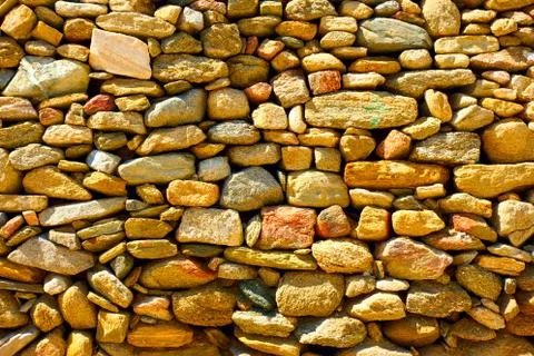 Masonry from rough cobblestone Stock Photos