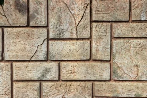 Masonry stone cladding wall texture. Geometric shapes surface background. Stock Photos
