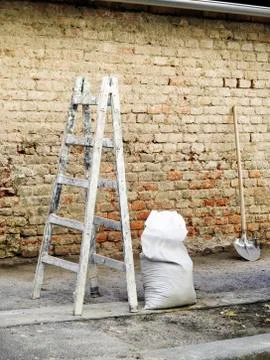 Masonry tools with the wall in the background Stock Photos