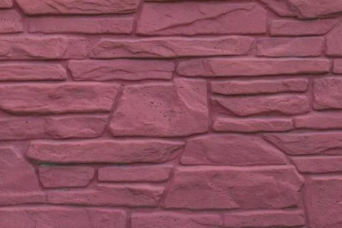 Masonry wall of red stone Stock Photos